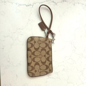 Coach wristlet.  Brown.  Used 1x and in excellent condition!